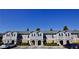 Wide shot of the townhouses highlighting their facades and curb appeal at 506 Summer Pl, Norcross, GA 30071