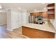 Modern kitchen featuring stainless steel appliances, wood cabinets, and breakfast bar at 506 Summer Pl, Norcross, GA 30071