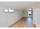 Bright living room featuring hardwood floors, crown moulding, a window and modern lighting at 506 Summer Pl, Norcross, GA 30071