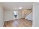 Open living room featuring wood floors, natural light, white trim and a staircase at 506 Summer Pl, Norcross, GA 30071