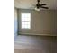 Bedroom features neutral walls, carpet, and a ceiling fan, offering a serene atmosphere at 7054 Shenandoah Trl, Austell, GA 30168