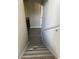 View down the stairway featuring light wood look flooring at 7054 Shenandoah Trl, Austell, GA 30168