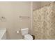 Bathroom with decorative shower curtain, toilet, and sleek fixtures creates a functional space at 910 Renaissance Way, Roswell, GA 30076