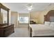 Bright bedroom featuring a bed, dresser, and window seat, offering a cozy and inviting space at 910 Renaissance Way, Roswell, GA 30076