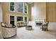 Elegant living room with high ceilings, fireplace, and ornate furniture at 910 Renaissance Way, Roswell, GA 30076