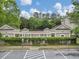 Community Pool area surrounded by lush greenery, perfect for a refreshing swim and relaxation at 910 Renaissance Way, Roswell, GA 30076