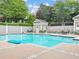 Enjoy the community pool, perfect for leisurely swims or relaxing on the surrounding lounge chairs at 910 Renaissance Way, Roswell, GA 30076