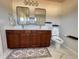 Modern bathroom with double vanity, sleek mirrors, and contemporary fixtures at 1603 Maston Rd, Auburn, GA 30011