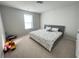 Simple bedroom with a patterned comforter and a bright window, perfect for a cozy night's sleep at 1603 Maston Rd, Auburn, GA 30011