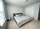 Comfortable bedroom with large window, gray bed frame and double closets at 1603 Maston Rd, Auburn, GA 30011