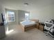 Bedroom featuring bright windows, neutral walls, and a work space at 1603 Maston Rd, Auburn, GA 30011