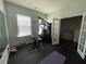 Bright home gym with natural light, exercise equipment, and neutral tones at 1603 Maston Rd, Auburn, GA 30011