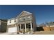 Beautiful two-story home with white columns on the porch and a well-maintained front lawn at 1603 Maston Rd, Auburn, GA 30011