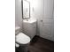 Cozy powder room with modern fixtures, vanity and wood style floors at 1603 Maston Rd, Auburn, GA 30011