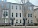 Townhome with brickwork, modern front door and black metal fencing at 169 Ward