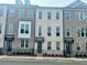 Attractive townhome showcasing brickwork, a modern front door and black metal fencing at 169 Ward