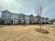 Street view of townhomes showcasing manicured lawns and a welcoming neighborhood at 169 Ward