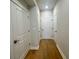 Hallway with neutral paint, hardwood floors, and clean lines at 169 Ward