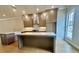 Gourmet kitchen features stainless appliances, shaker cabinets and large center island at 169 Ward