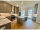 Kitchen with stainless appliances, custom cabinets, large island and modern pendant lighting at 169 Ward