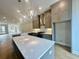 Gourmet kitchen featuring stainless appliances, shaker cabinets and large center island at 169 Ward