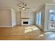 Bright living room with a fireplace and hardwood floors at 169 Ward