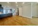 Open floorplan featuring hardwood floors connecting the kitchen and living area at 169 Ward