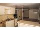 Basement featuring a small kitchen area with a sink and cabinets at 3204 Spreading Oak Sw Dr, Atlanta, GA 30311