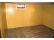 Unfinished basement with yellow walls and a small window at 3204 Spreading Oak Sw Dr, Atlanta, GA 30311