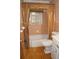 Compact bathroom featuring a tile shower/tub, toilet, vanity and flooring at 3204 Spreading Oak Sw Dr, Atlanta, GA 30311