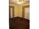 Bedroom with brown carpeting, two windows with curtains and a ceiling light fixture at 3204 Spreading Oak Sw Dr, Atlanta, GA 30311