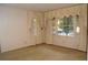 Bedroom with two large windows and neutral-colored curtains at 3204 Spreading Oak Sw Dr, Atlanta, GA 30311