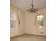 Dining room featuring a chandelier and two windows with decorative curtains at 3204 Spreading Oak Sw Dr, Atlanta, GA 30311