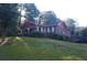 Charming brick home with landscaped yard and covered front porch at 3204 Spreading Oak Sw Dr, Atlanta, GA 30311