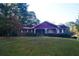 Charming brick home with a large front yard and mature trees at 3204 Spreading Oak Sw Dr, Atlanta, GA 30311