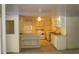 Basement kitchen with white cabinets, appliances, and ample counter space at 3204 Spreading Oak Sw Dr, Atlanta, GA 30311