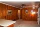 Cozy wood-paneled living room with a bar area at 3204 Spreading Oak Sw Dr, Atlanta, GA 30311