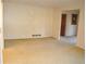 The living room features neutral carpeting and a large opening to a doorway at 3204 Spreading Oak Sw Dr, Atlanta, GA 30311