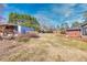 View of home's spacious backyard with shed and patio area at 4031 Pine Needle Dr, Duluth, GA 30096