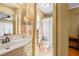 Vintage bathroom with sink, mirror, and shower at 4031 Pine Needle Dr, Duluth, GA 30096