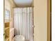 Cozy bathroom featuring a shower with a decorative curtain at 4031 Pine Needle Dr, Duluth, GA 30096