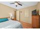 Cozy bedroom featuring hardwood floors and a ceiling fan at 4031 Pine Needle Dr, Duluth, GA 30096