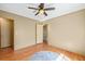 Bedroom with hardwood floors and a ceiling fan and access to other rooms at 4031 Pine Needle Dr, Duluth, GA 30096