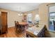 Bright dining room with a classic chandelier, hardwood floors, and ample seating at 4031 Pine Needle Dr, Duluth, GA 30096