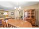 Elegant dining area featuring a wooden table, built-in cabinet, and natural light at 4031 Pine Needle Dr, Duluth, GA 30096