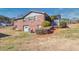 Back exterior of a brick home with a garage and foliage at 4031 Pine Needle Dr, Duluth, GA 30096