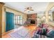 Living room featuring a fireplace, wood floors, and a sliding glass door at 4031 Pine Needle Dr, Duluth, GA 30096