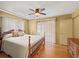 Bedroom with wood floors, ceiling fan and bright natural light at 4031 Pine Needle Dr, Duluth, GA 30096