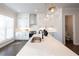 Well-lit kitchen with sleek countertops, an island, stainless steel appliances, and white cabinetry at 606 Goldsmith Ct # 114, Johns Creek, GA 30022