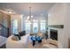 Bright and stylish living room with a fireplace, large windows, and comfortable modern seating area at 606 Goldsmith Ct # 114, Johns Creek, GA 30022